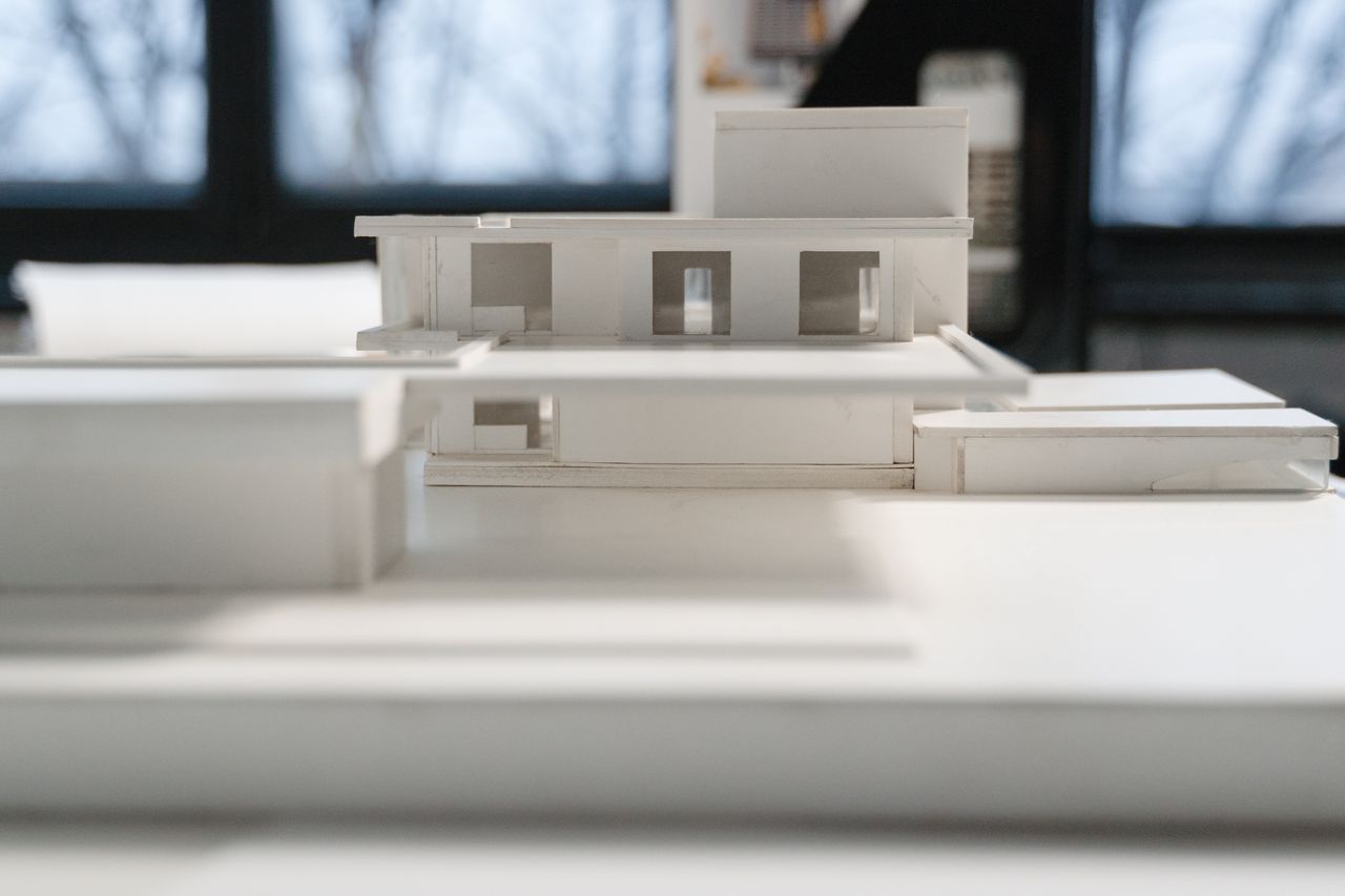 The Art of Drawing Readers In: Your attractive post title goes here Detailed miniature architectural model indoors with natural light and modern design elements.
